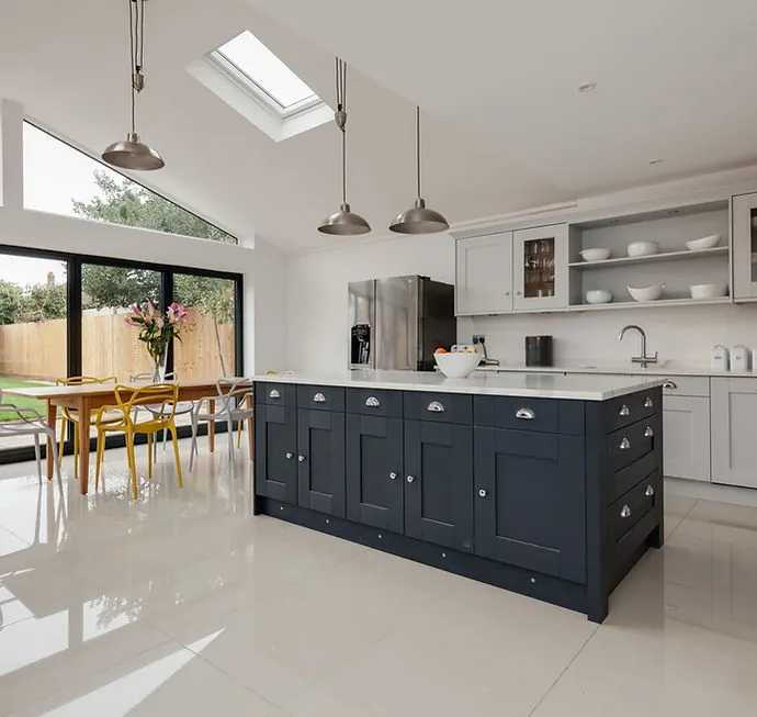 A bright open-plan home extension with a fitted kitchen and skylights
