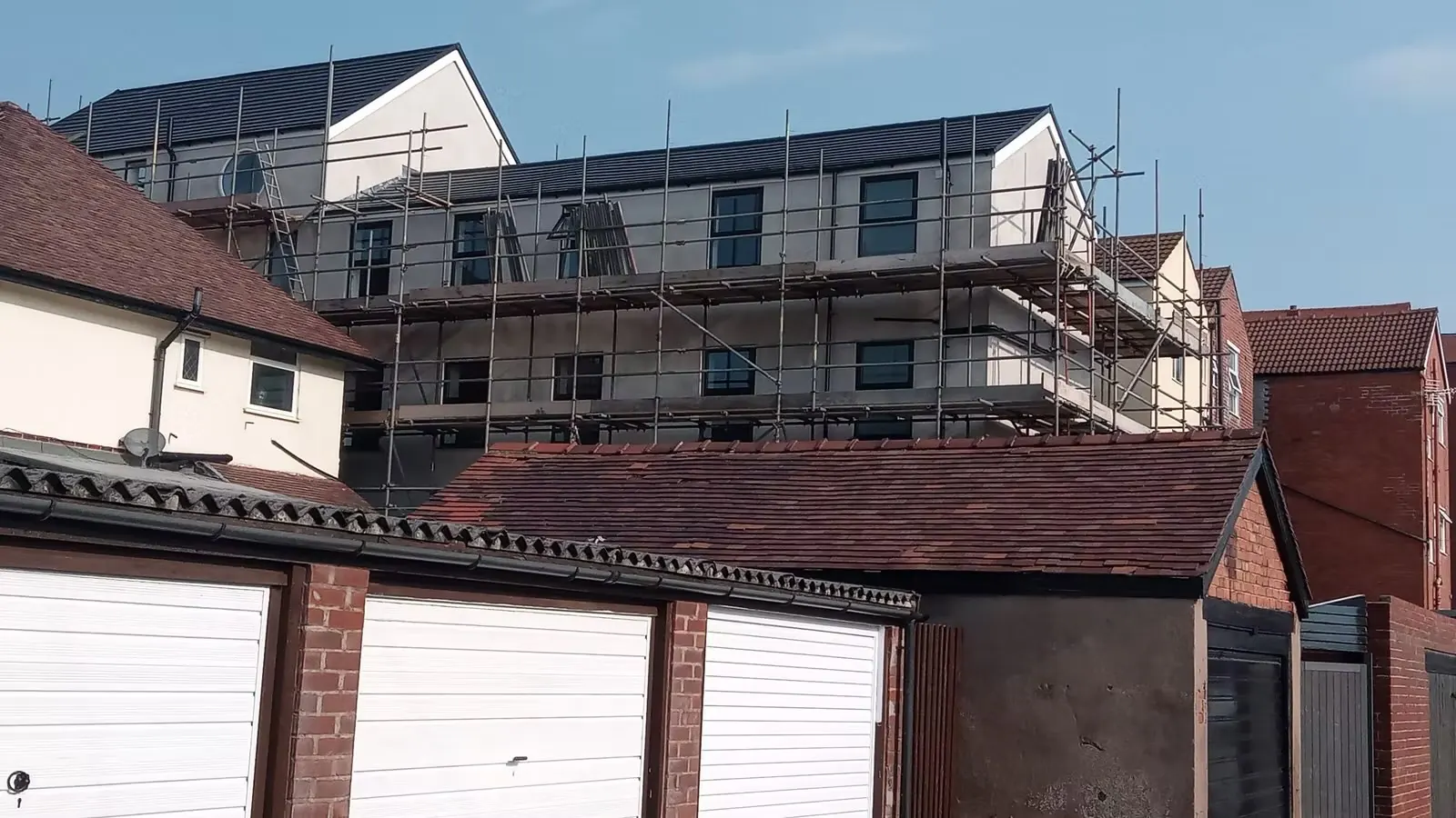 A scaffolded building under refurbishment by Total Building North West